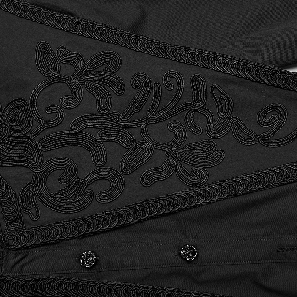 Intricate black lace detailing on Gothic shirt with rose buttons and ruffle accents for a retro style.