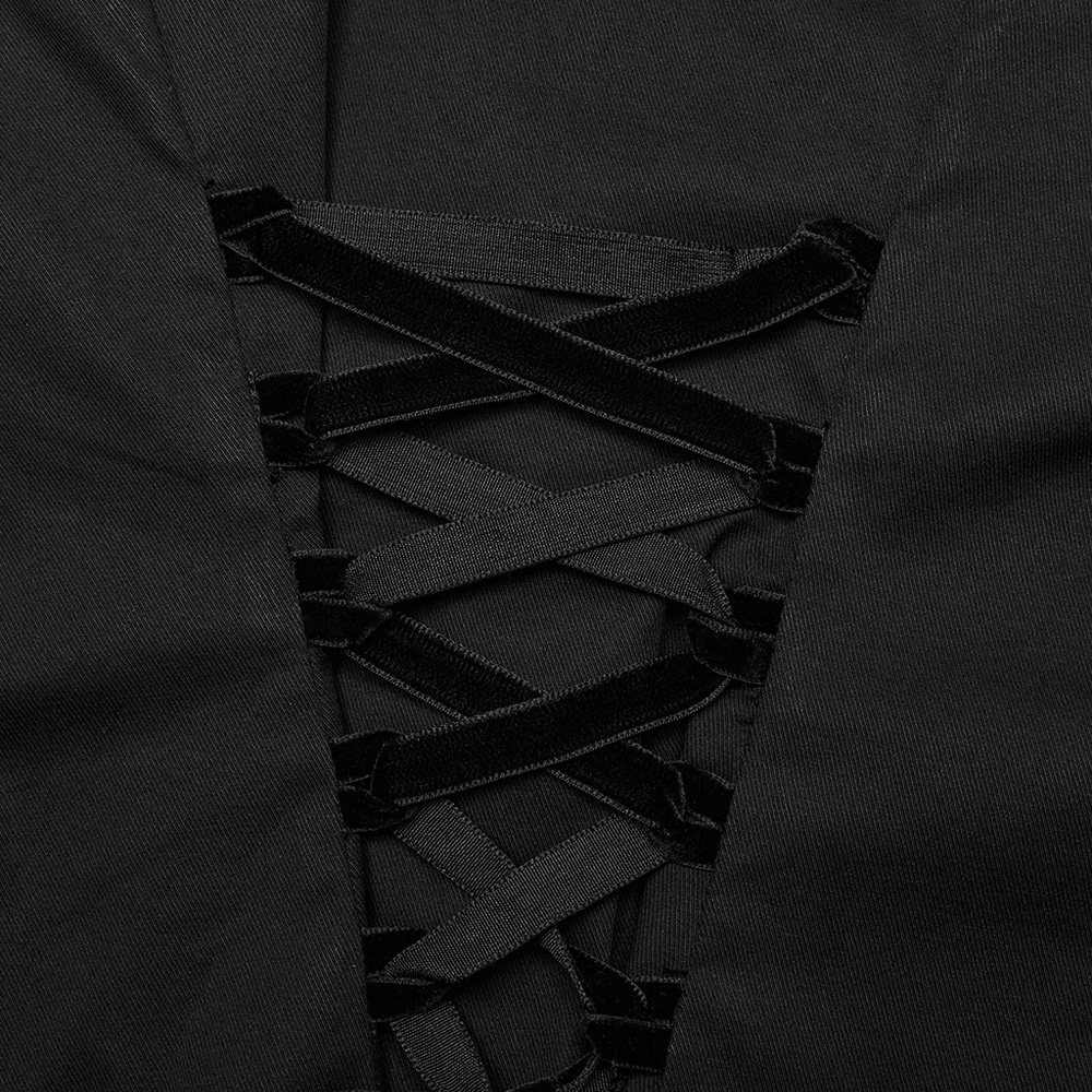 Close-up of gothic wide shoulder shirt showcasing intricate lace-up detail with black velvet ribbons.
