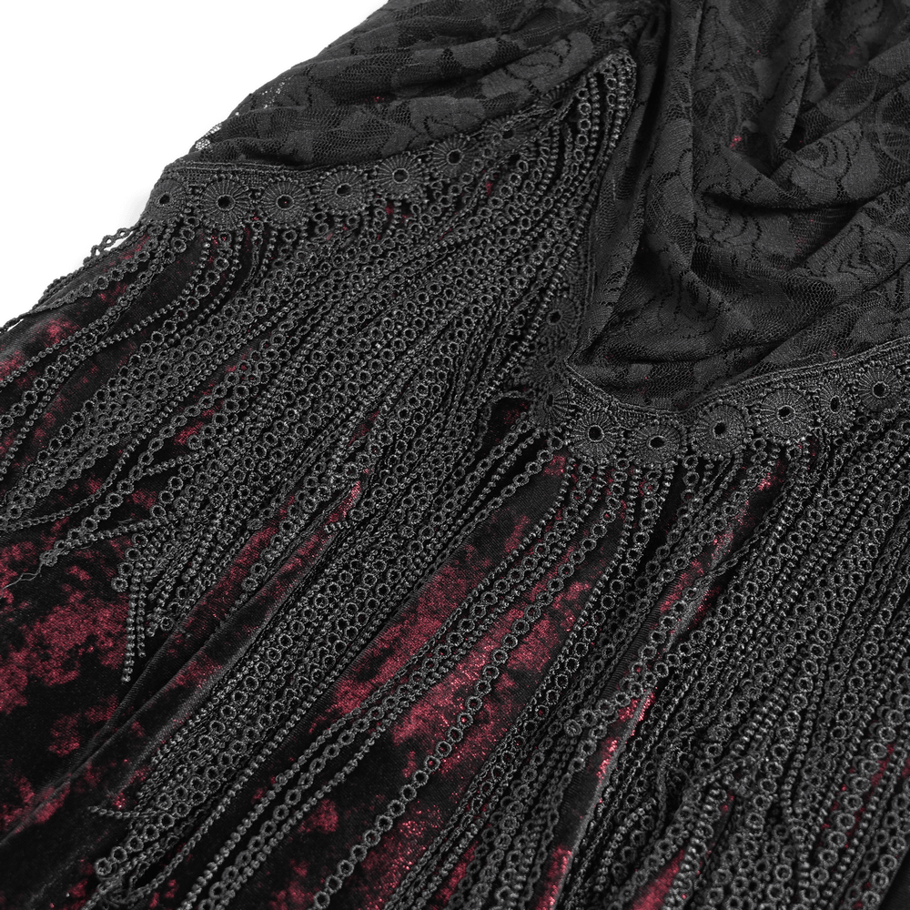 Gothic red and black velvet dress with intricate lace and dramatic fringe details.