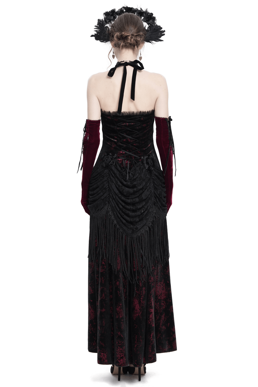 Back view of Gothic wine red and black velvet dress with lace and fringe, showcasing halter neck and corset design.