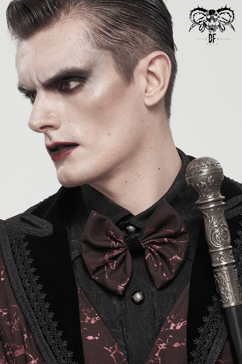 Gothic wine red jacquard bowtie showcased by a model with dramatic makeup and stylish attire.