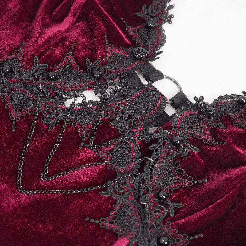 Close-up of gothic wine red dress featuring intricate black lace and seductive cutout detail.