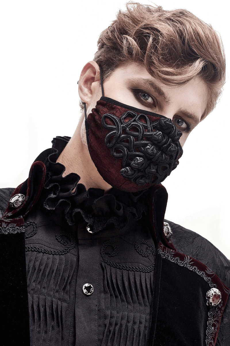 Model wearing a gothic wine red mask with black embroidery and adjustable straps, styled elegantly.