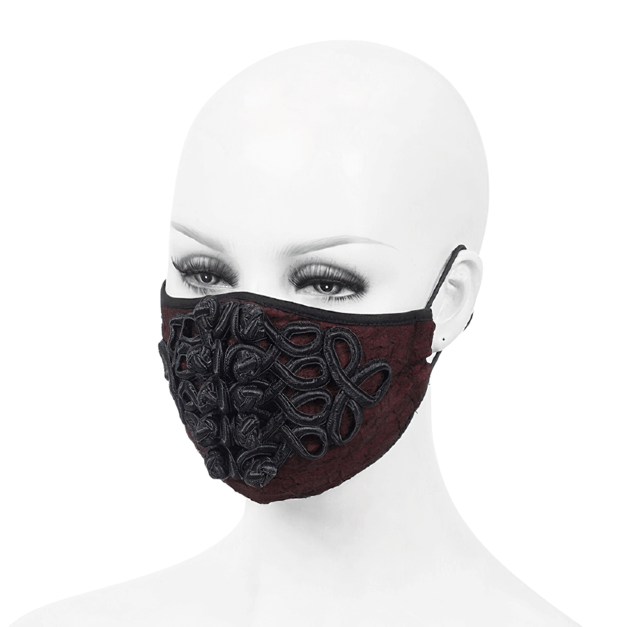 Gothic wine red mask with black embroidery and adjustable straps on a mannequin.