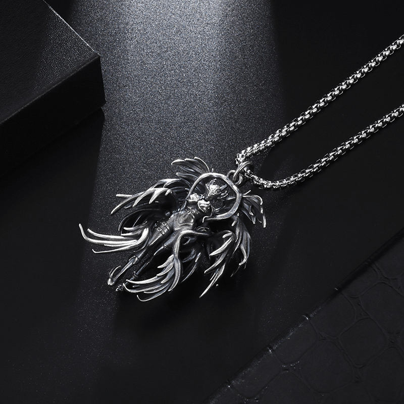 Gothic winged angel pendant necklace in stainless steel on a chain, perfect for punk and alternative fashion.
