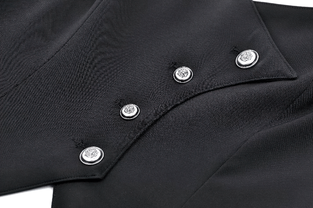 Close-up of ornate silver buttons on a black gothic corset top, showcasing intricate detailing and elegant design.