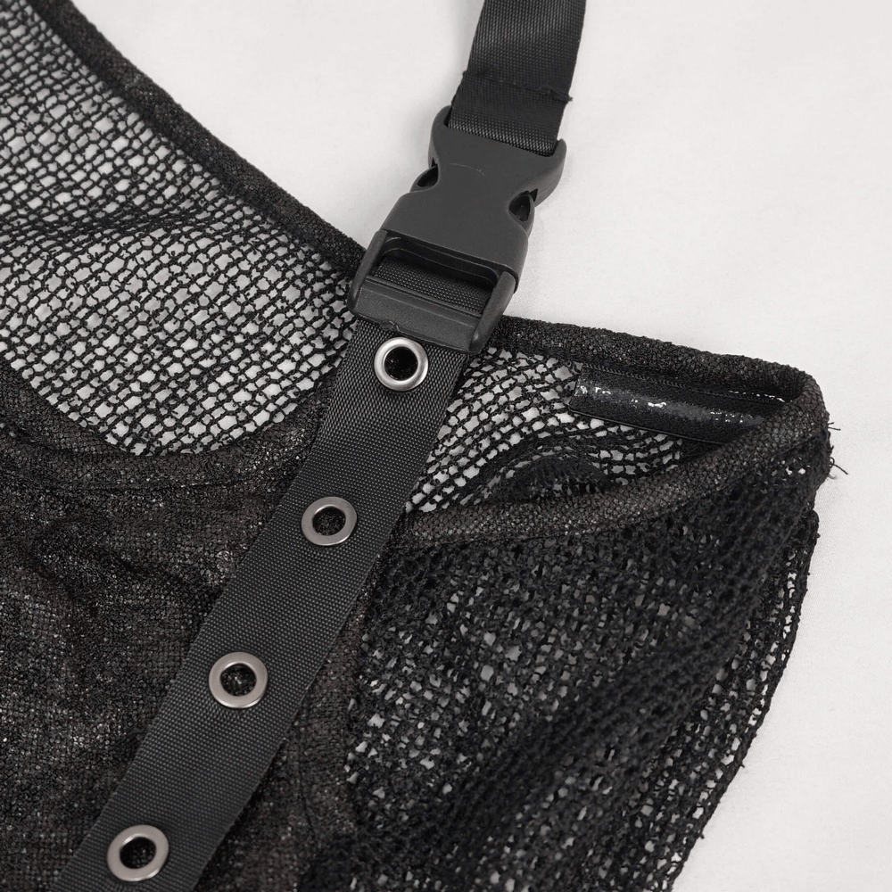 Close-up of gothic black mesh top strap with edgy buckle and eyelet details for steampunk style fashion.