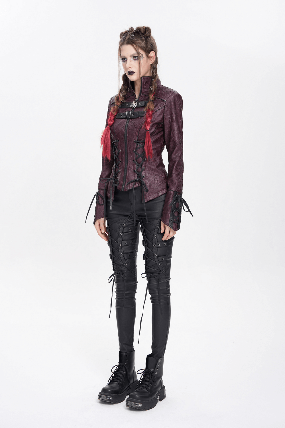Gothic women in a purple faux leather jacket with buckles and lace details, showcasing edgy alternative fashion.