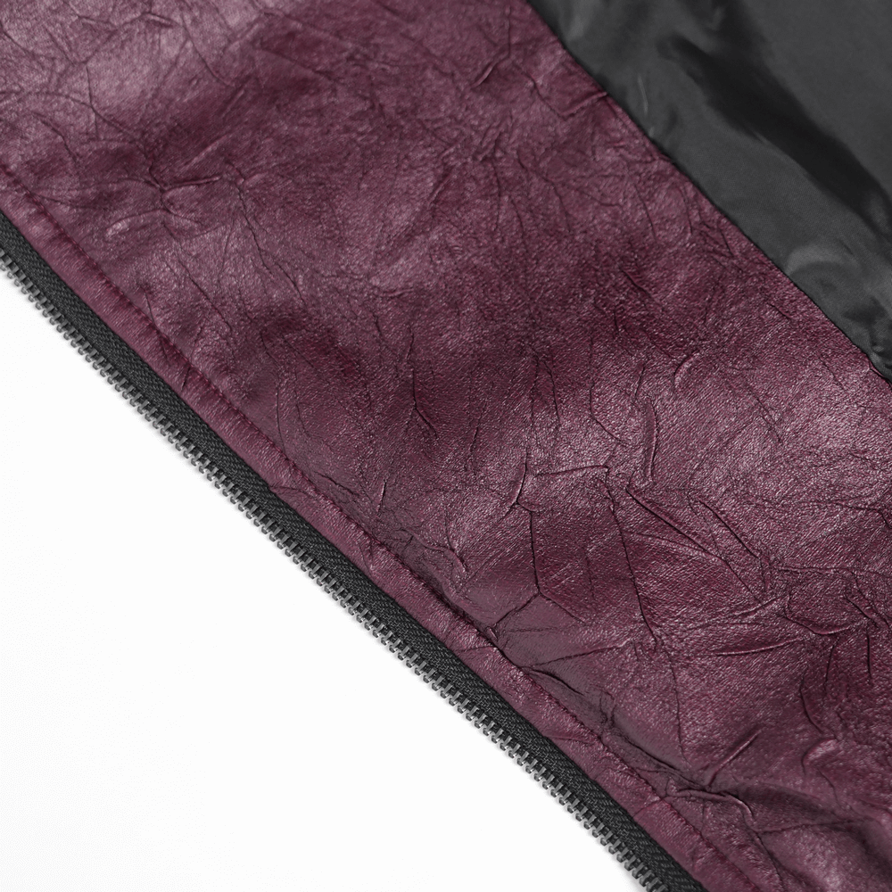Close-up of rich purple faux leather texture of gothic women's jacket with detailed zip.