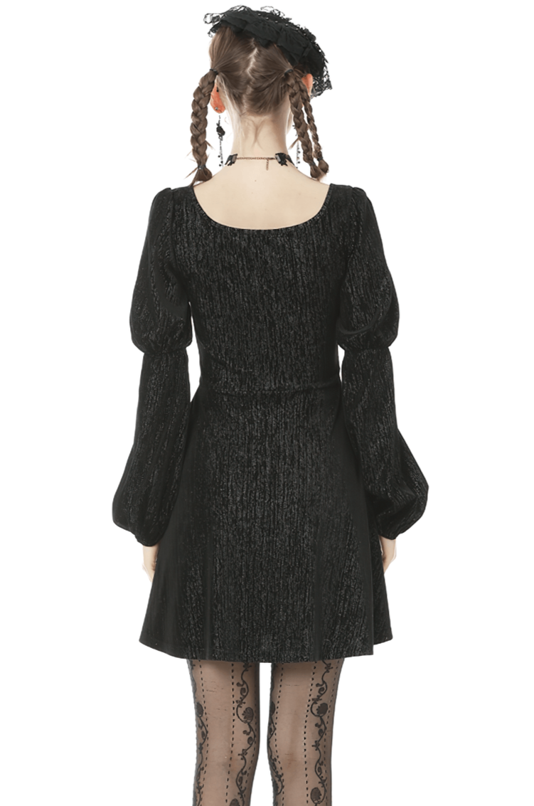 Back view of gothic women's black mini dress with puffed sleeves, showcasing elegant lace details.