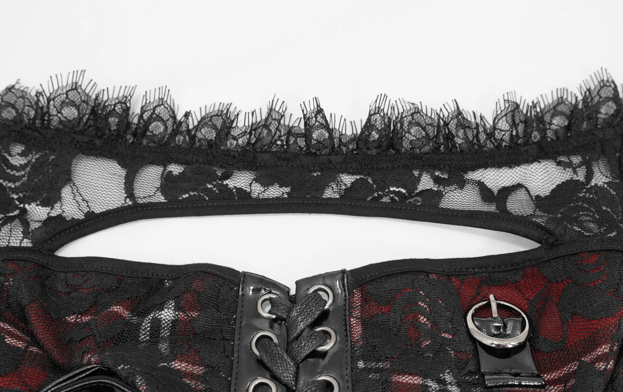Close-up of Gothic black lace with floral pattern and red accents on a stylish crop top collar.