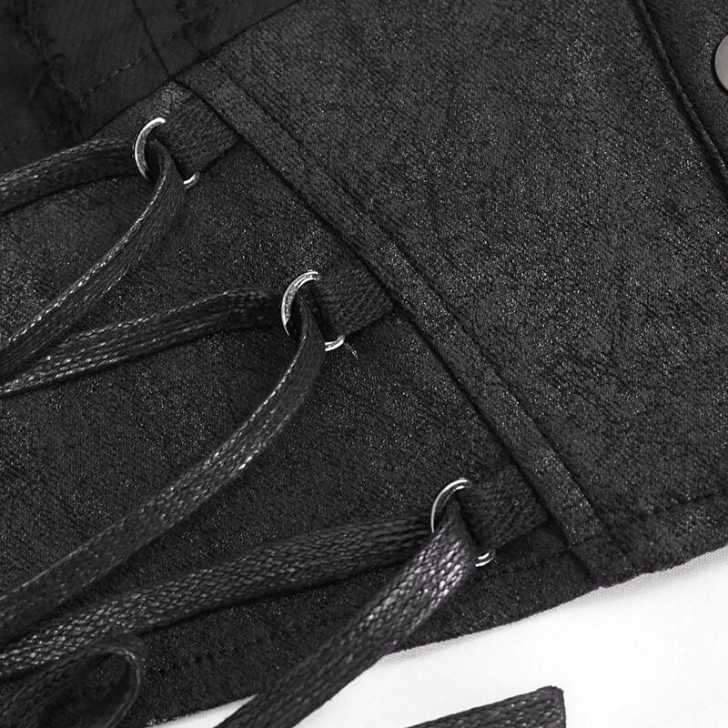 Detail view of black gothic blouse showing stylish lace-up design and silver buttons for a trendy look.