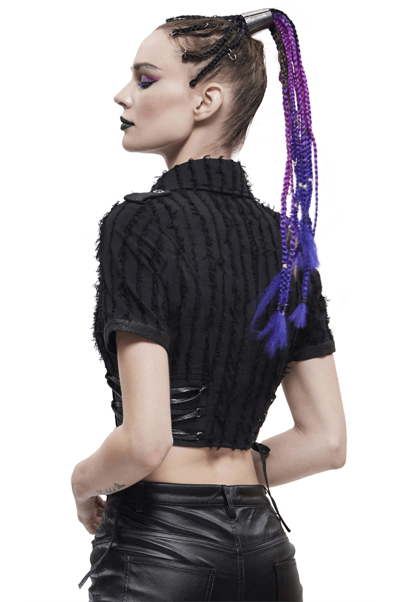 Gothic black short sleeve blouse with silver buttons, modern design, worn by model with stylish braided hair.