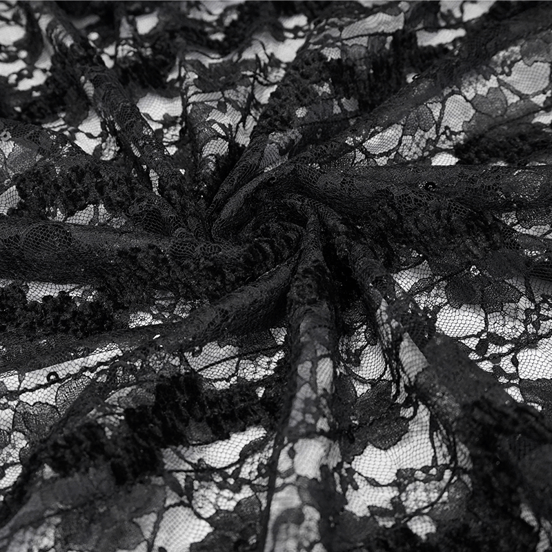 Close-up of intricate black lace fabric, perfect for gothic vintage clothing styles.