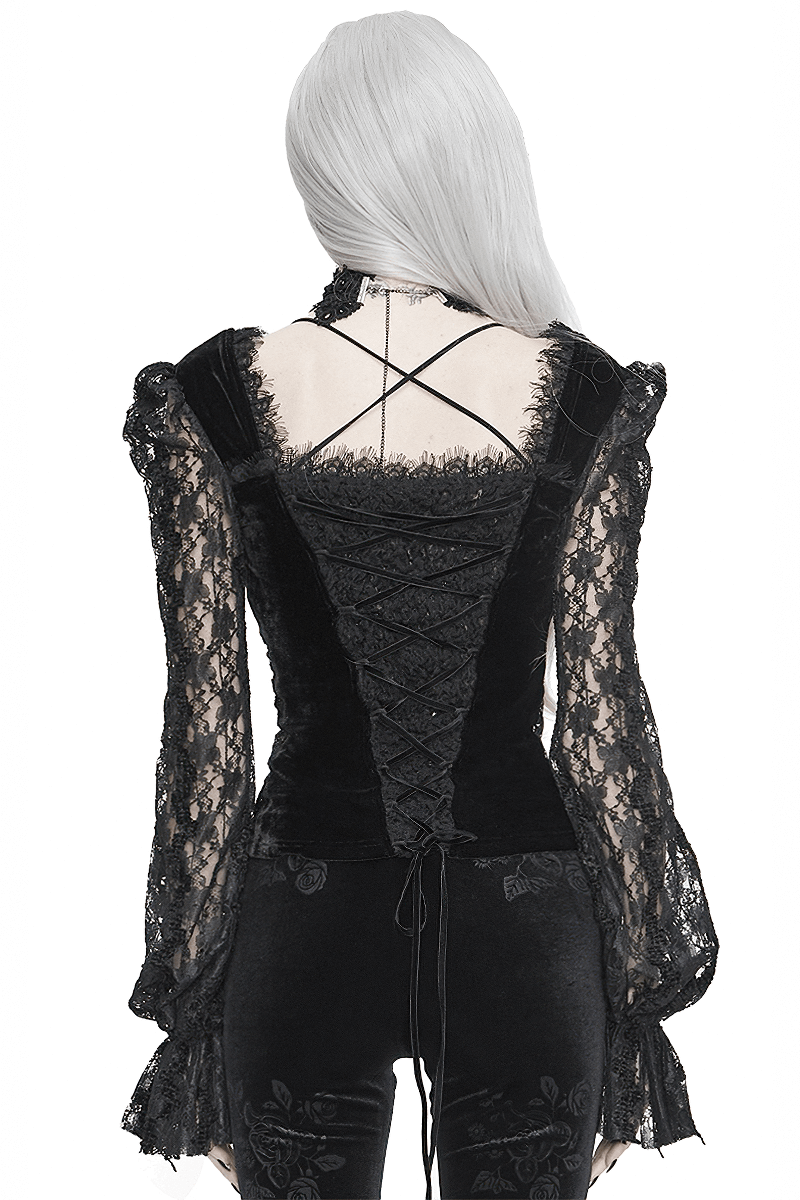Back view of gothic women's black velvet and lace top featuring ruched sleeves and stylish lace-up detail.