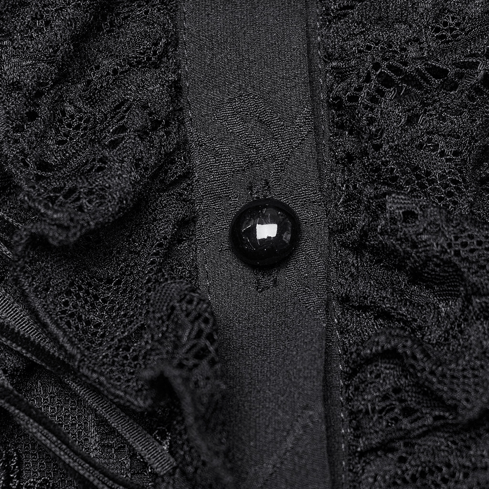 Close-up of Gothic blouse lace and black button detail, showcasing intricate design and elegant texture.
