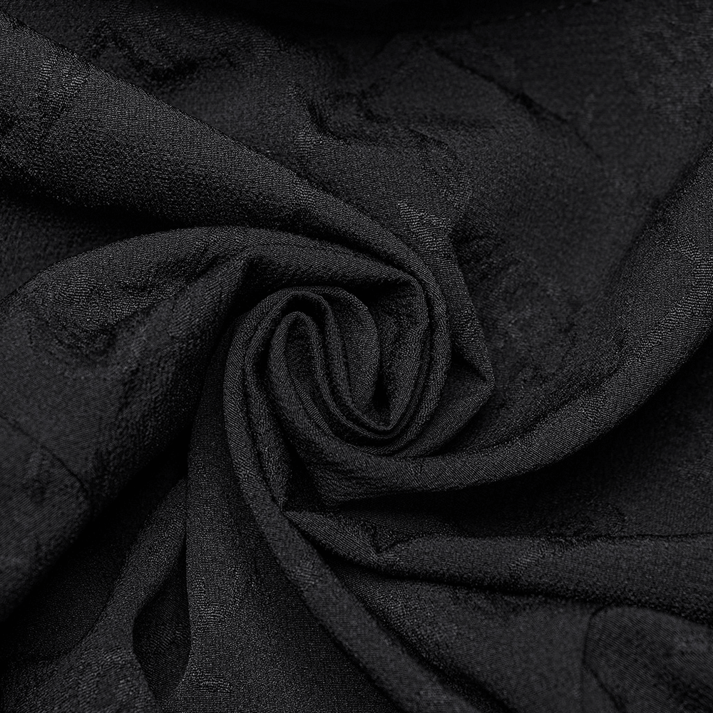 Close-up of luxurious black Gothic fabric, showcasing intricate texture and quality for stylish blouse designs.