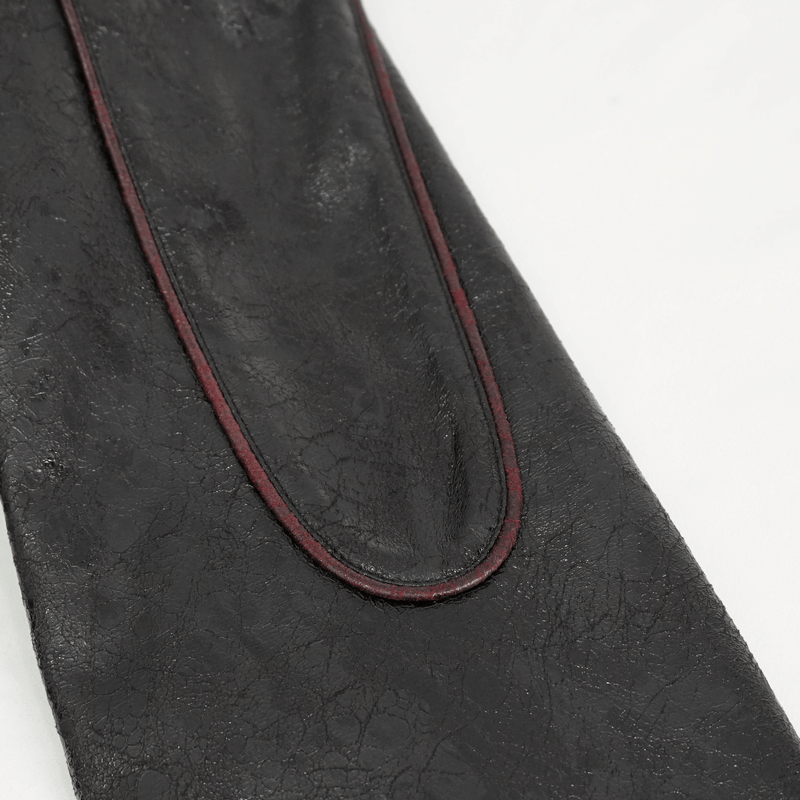Close-up of textured faux leather with red stitching on gothic women's mid-length coat sleeve.