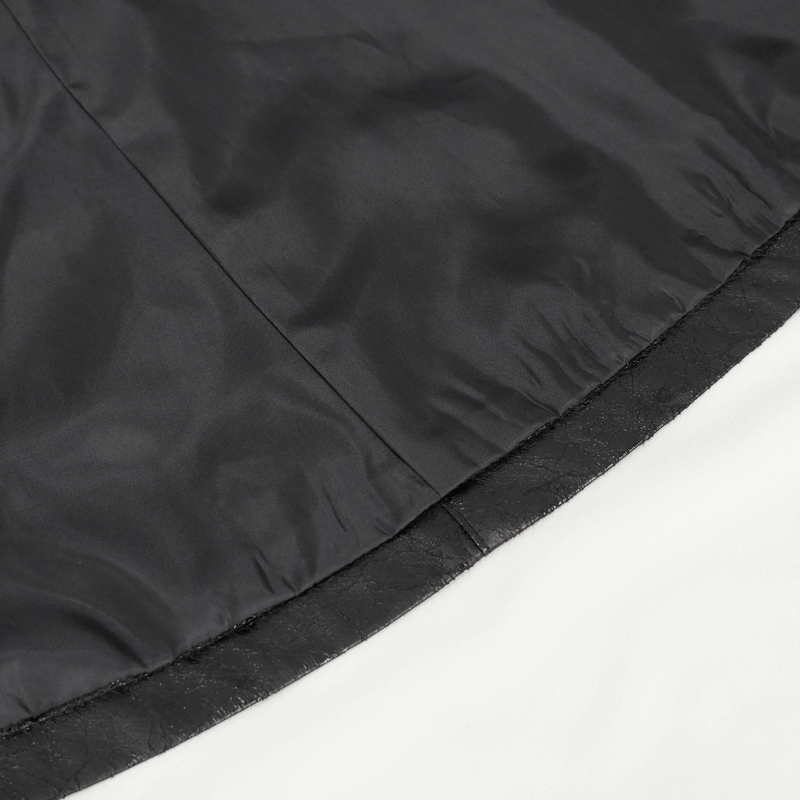 Close-up of the interior lining and faux leather edge of a gothic women's mid-length coat.