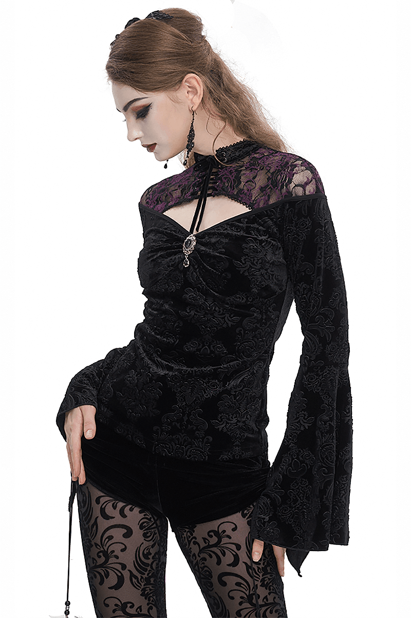 Gothic women's black cutout top with flared sleeves and floral embossing, showcasing a darkly romantic style.