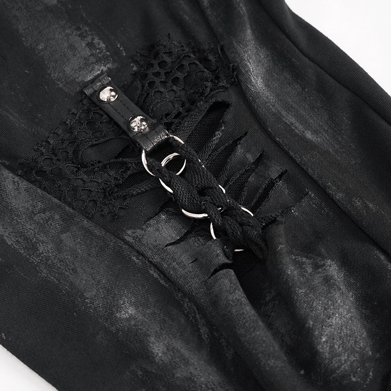 Close-up of black gothic cargo pants featuring metal rivets, lace detailing, and chains for a trendy, edgy look.