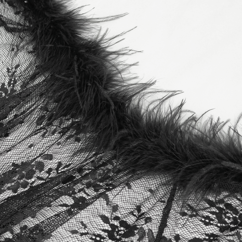 Close-up of gothic floral lace cape with irregular fluffy hem, showcasing intricate lace details and soft black fluff.