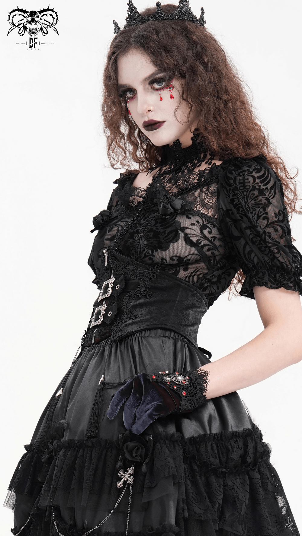 Gothic woman in lace corset, ruffled skirt, and gloves, showcasing dark elegance and Victorian style.