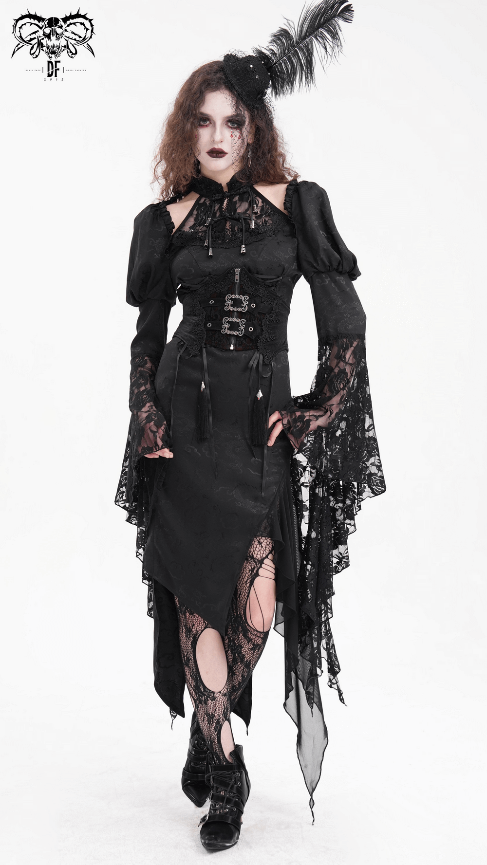 Gothic woman in black lace corset dress with tassels and feather headpiece, exuding dark romanticism and style.