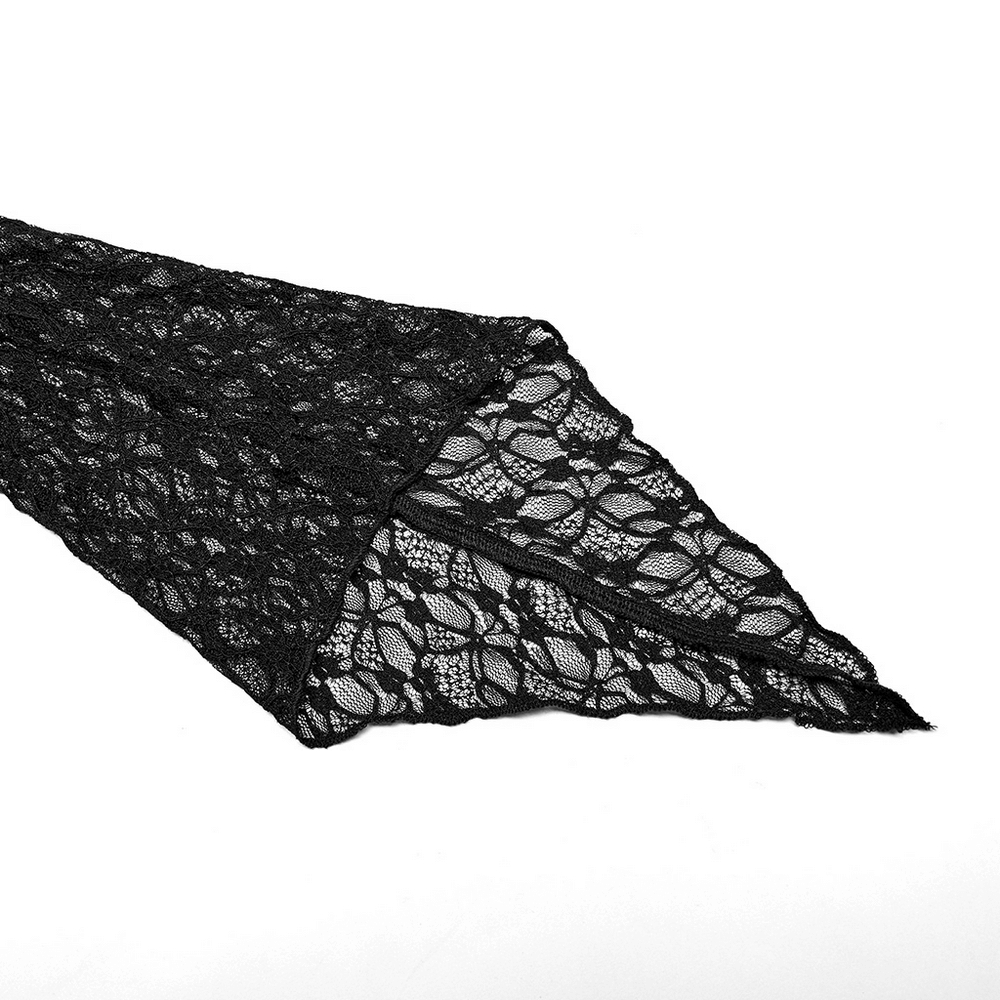 Close-up of black jacquard lace fabric showcasing intricate floral patterns and delicate texture.