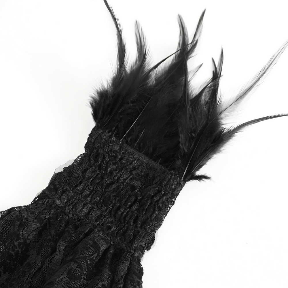 Close-up of Gothic black lace fingerless gloves featuring dramatic cascading black feathers.