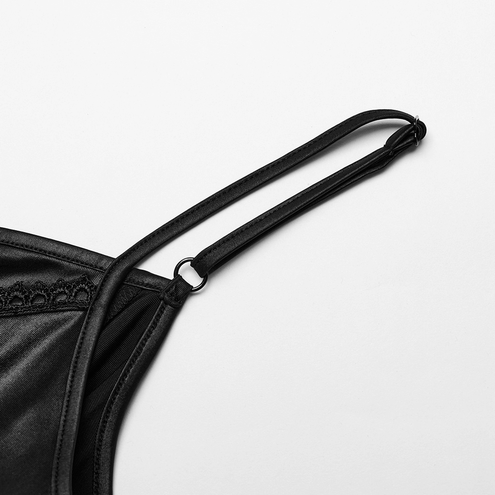 Close-up of a black satin dress strap featuring a delicate lace detail and adjustable slider.