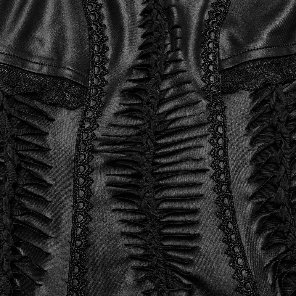 Close-up of black gothic dress detailing with lace and textured ruffles for a dramatic, elegant look.