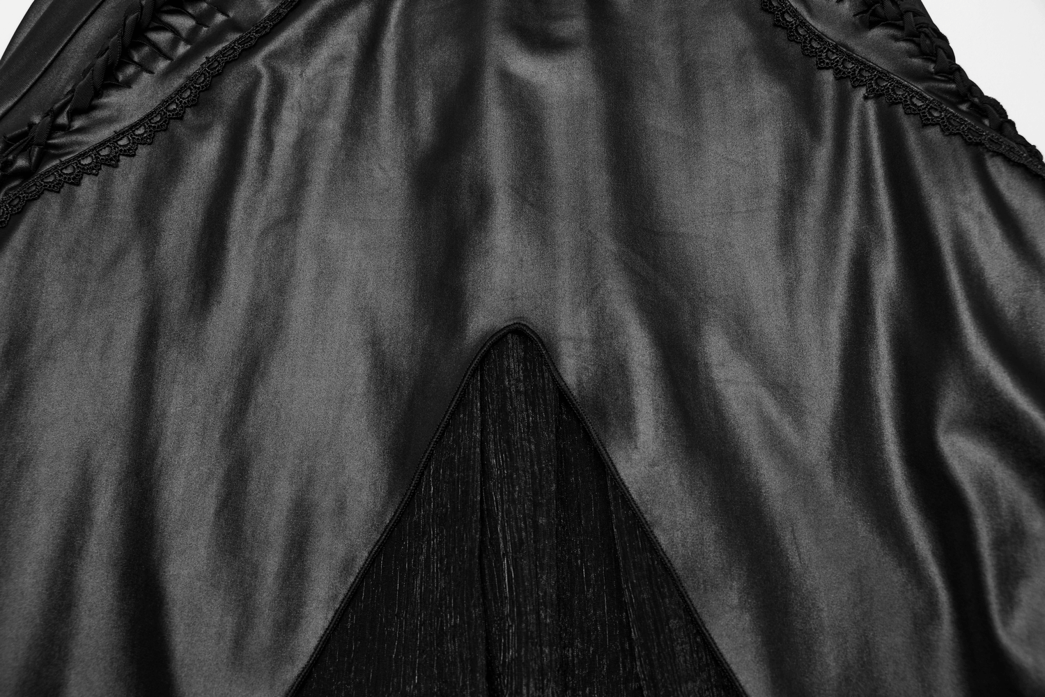 Close-up of the dramatic lace-up back of a black Gothic women's dress, showcasing intricate textures and elegant design.