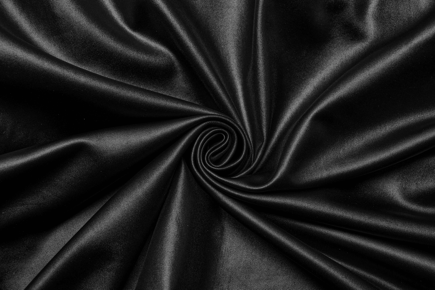 Luxurious black satin fabric showcasing a smooth, glossy texture, perfect for elegant gothic attire.