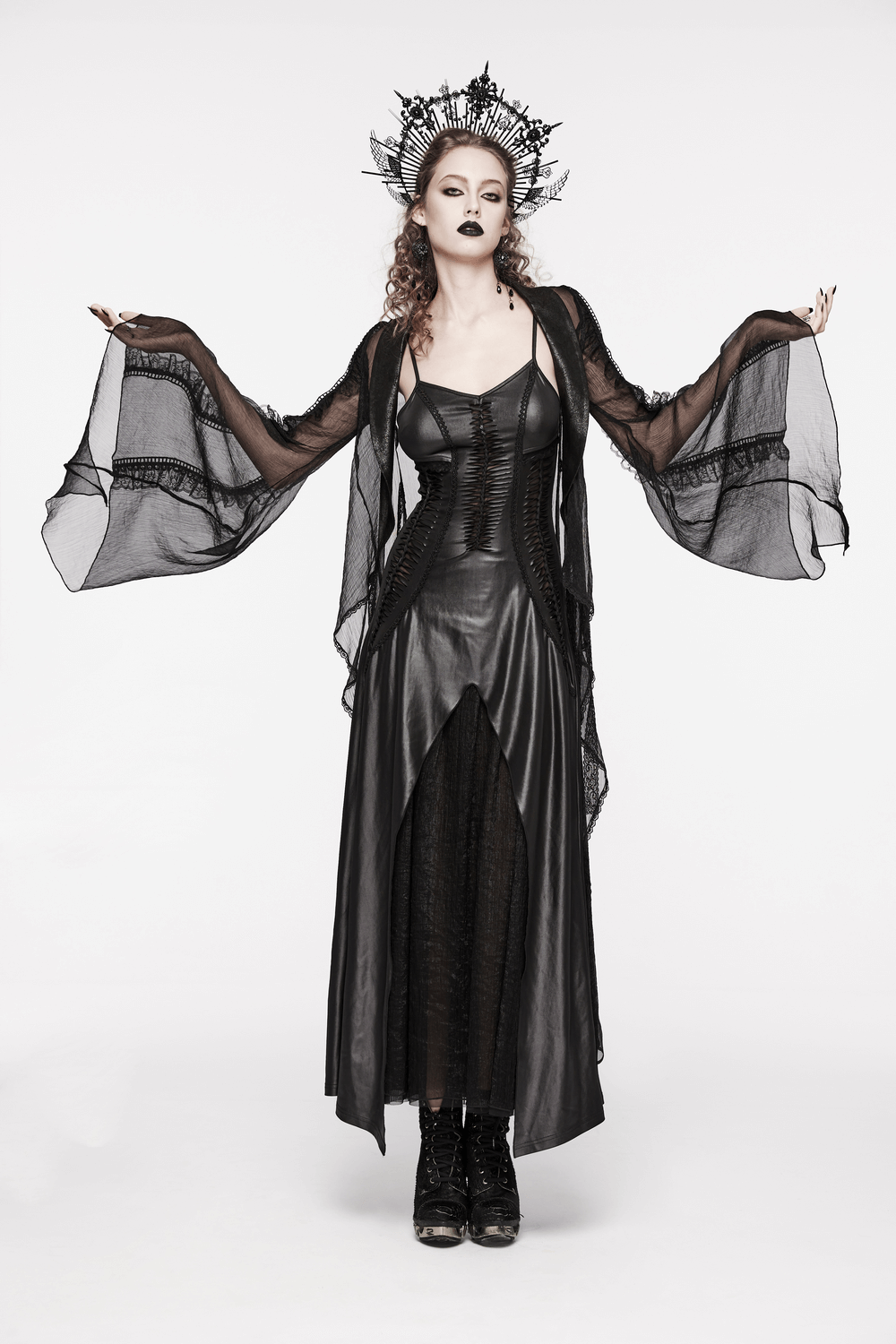 Gothic women's black lace-up back long dress with flowing sheer sleeves and dramatic crown accessories.