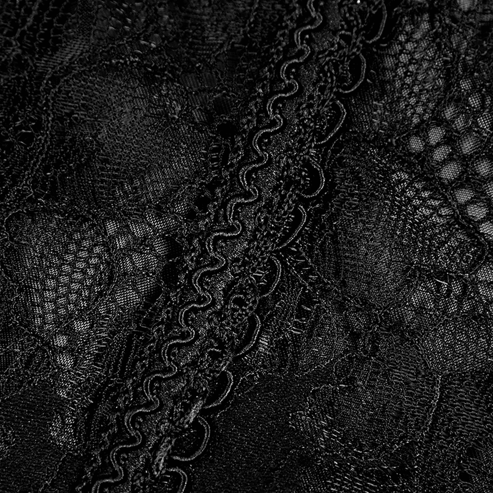 Close-up of intricate black lace fabric featuring textured patterns and scalloped edges for Gothic corset design.