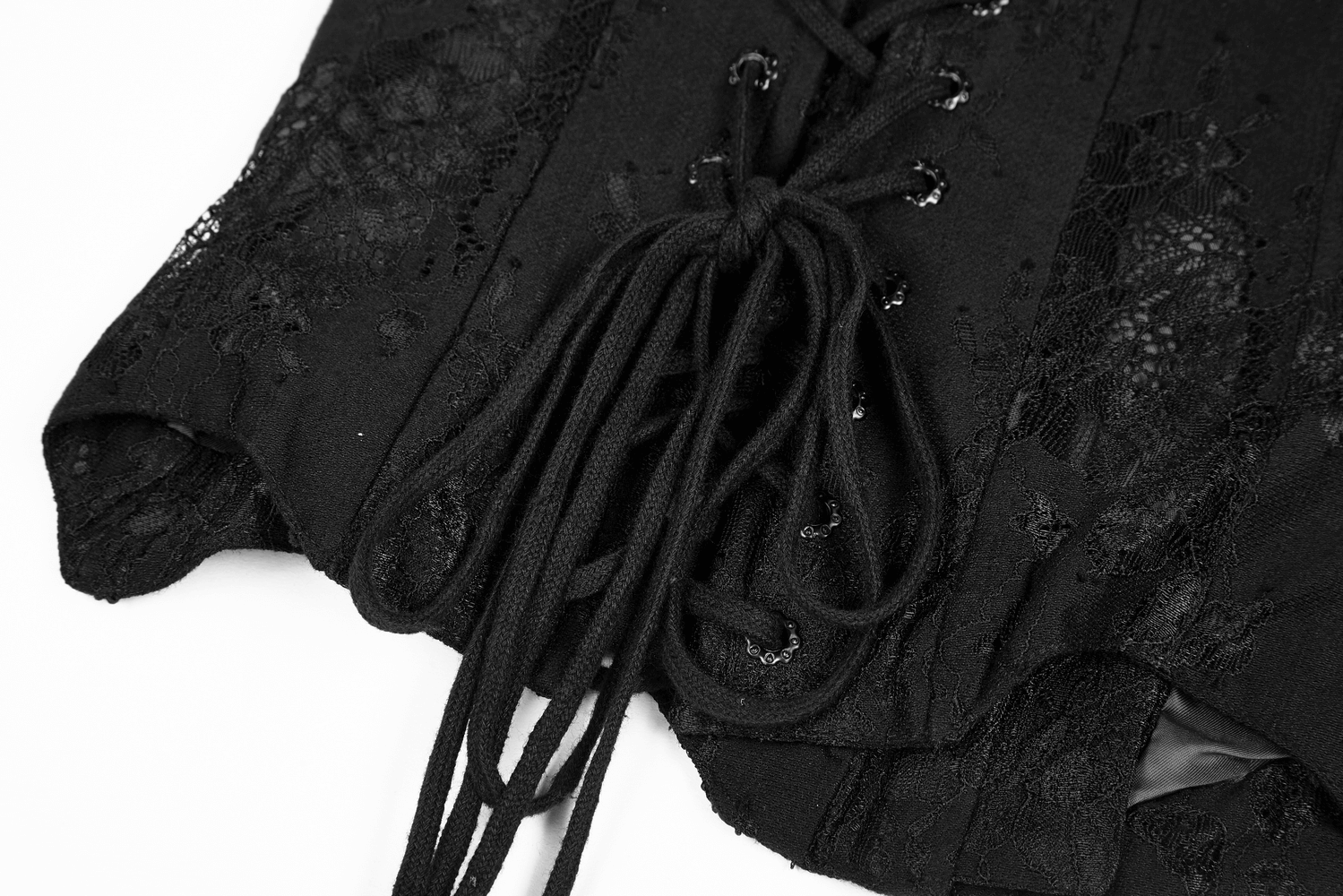 Close-up of a black Gothic lace-up corset showcasing intricate lace and dramatic lace ties.