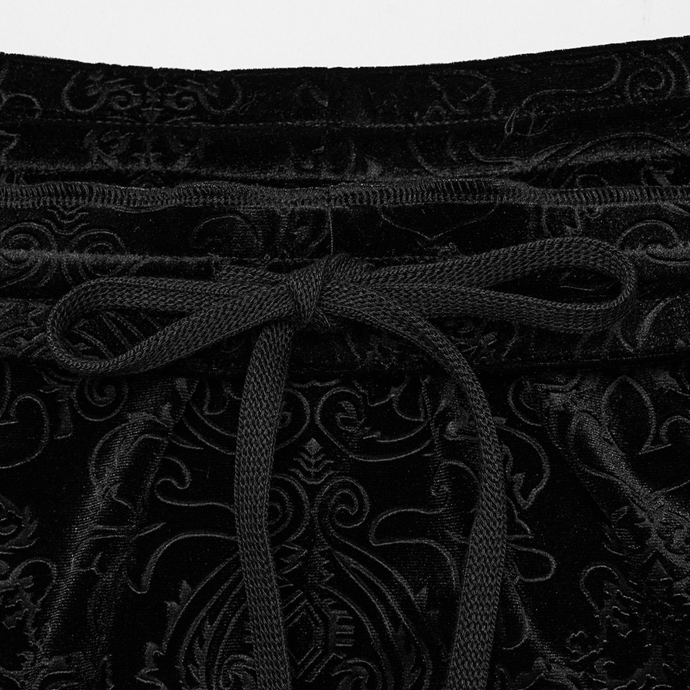 Close-up of black embossed velvet texture with lace-up drawstring detailing for women's gothic skirt.