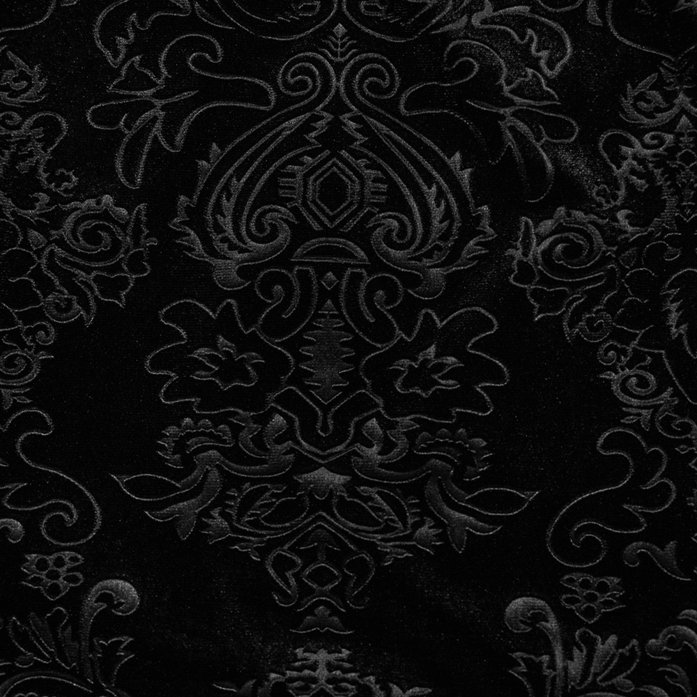 Embossed black velvet fabric featuring intricate gothic floral patterns.