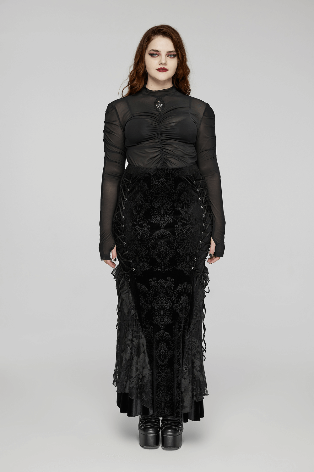 Gothic women's lace-up embossed velvet fishtail skirt, layered lace hem, and sheer black top for a dark, elegant vibe.