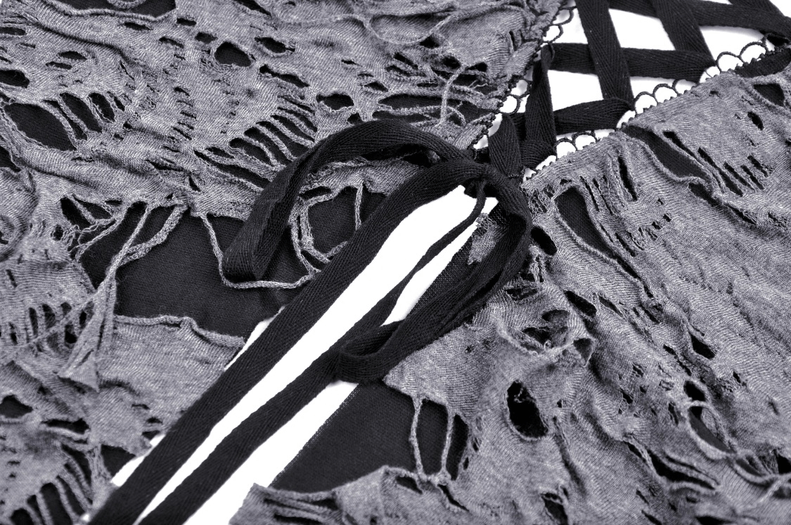 Close-up of Gothic lace-up shredded top detailing with dramatic texture and black laces against a light background.