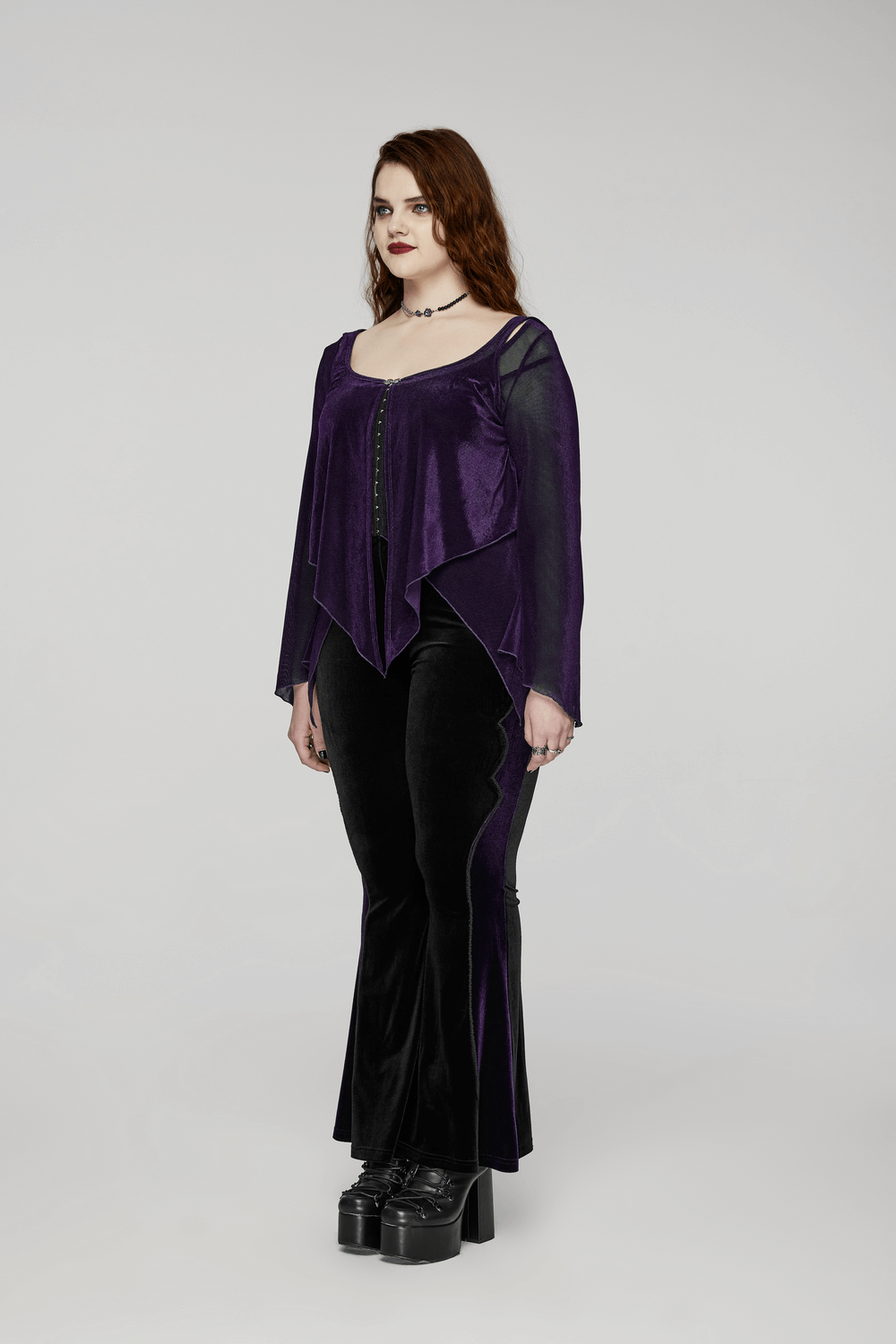 Gothic women's layered mesh top in purple with lace hooks, styled with black flared pants and platform boots.