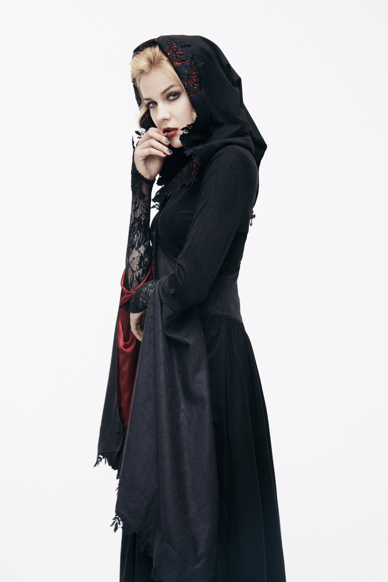 Elegant gothic woman wearing a long black coat with a hood and lace details, striking a poised pose.