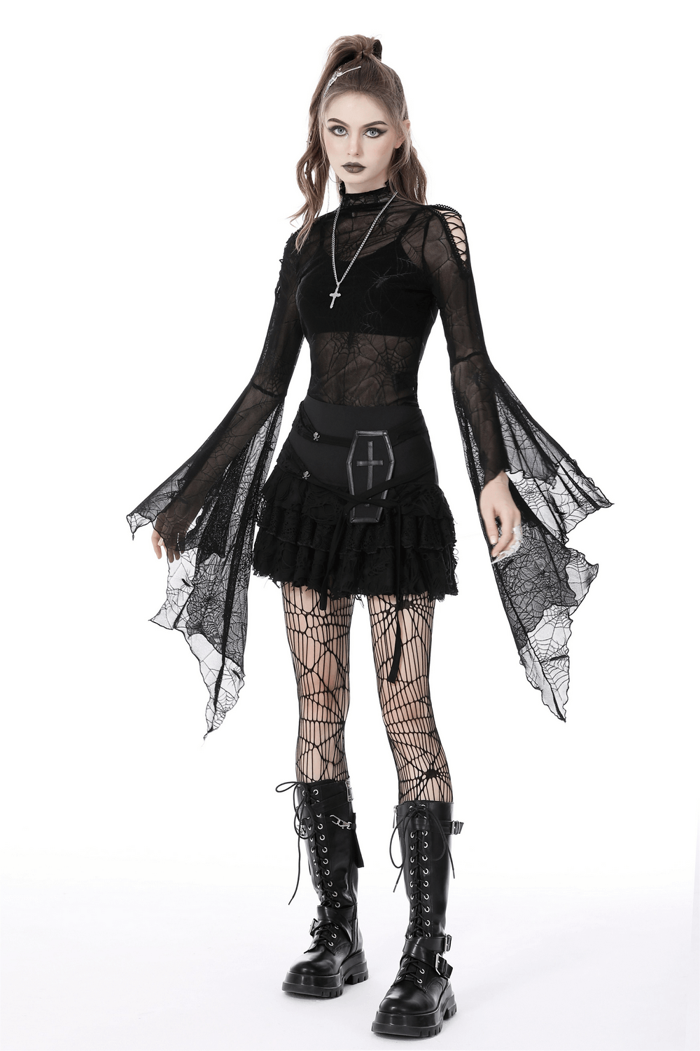 Gothic black mesh top with spiderweb design, long sleeves, styled with ruffled skirt and fishnet tights.