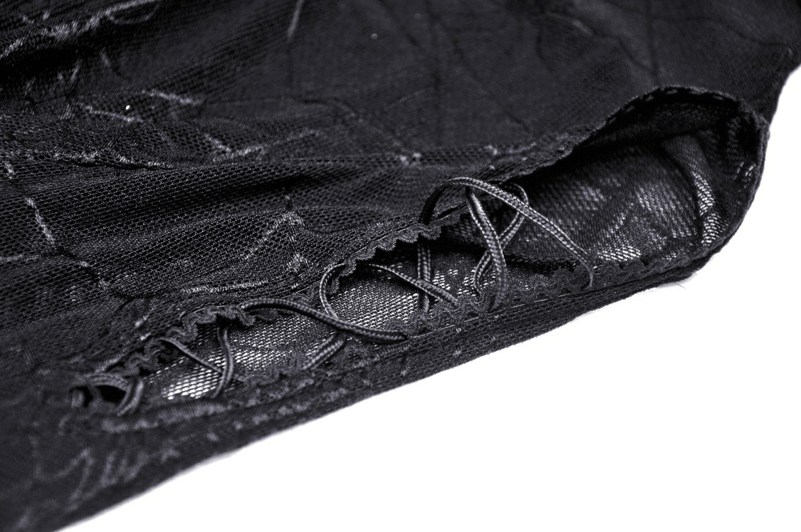 Close-up of the intricate lace detail on a Gothic black mesh top with spiderweb design.