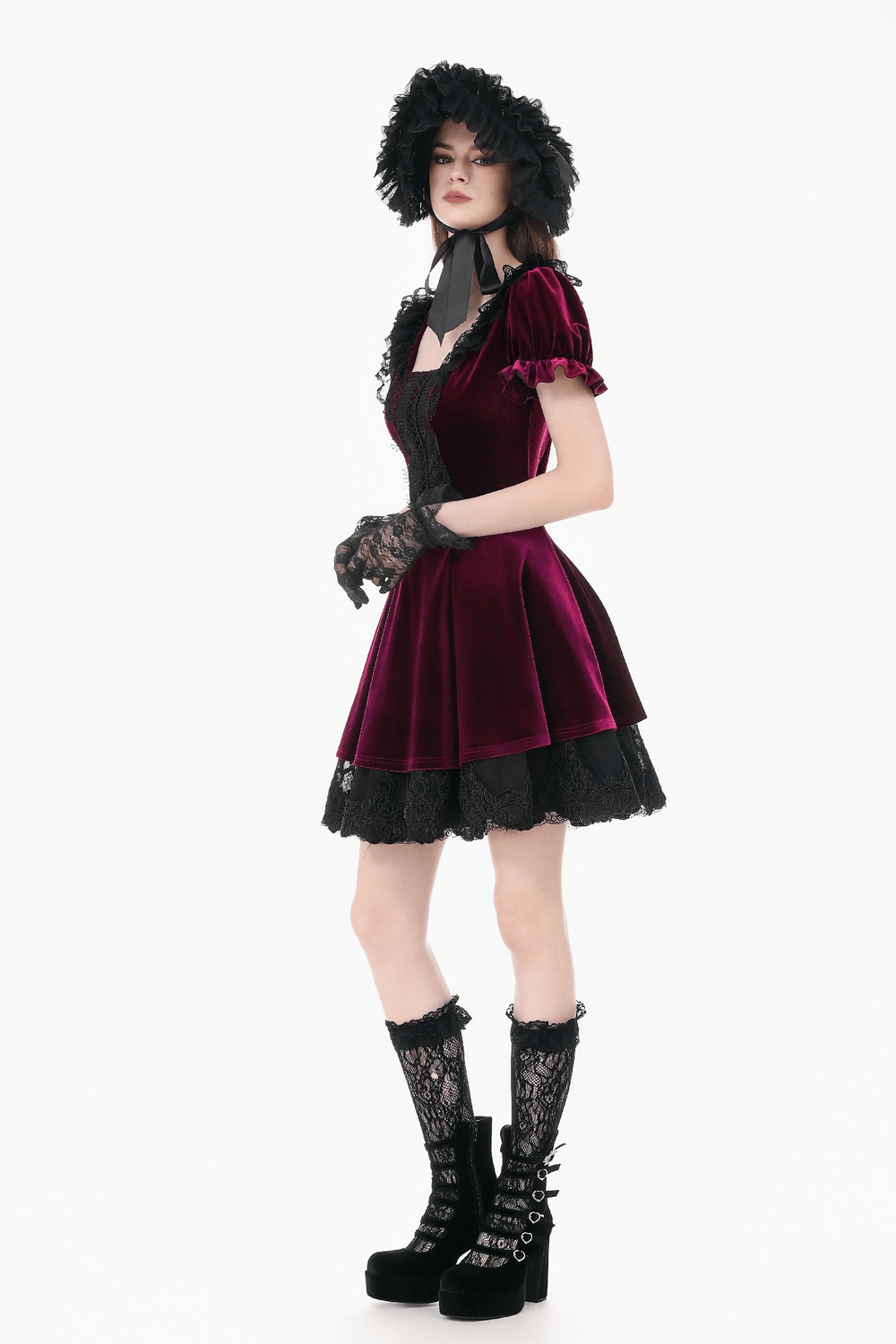 Gothic Women's Mini Dress with Lace Trim and Puff Sleeves showcased in a model with dark accessories and boots.