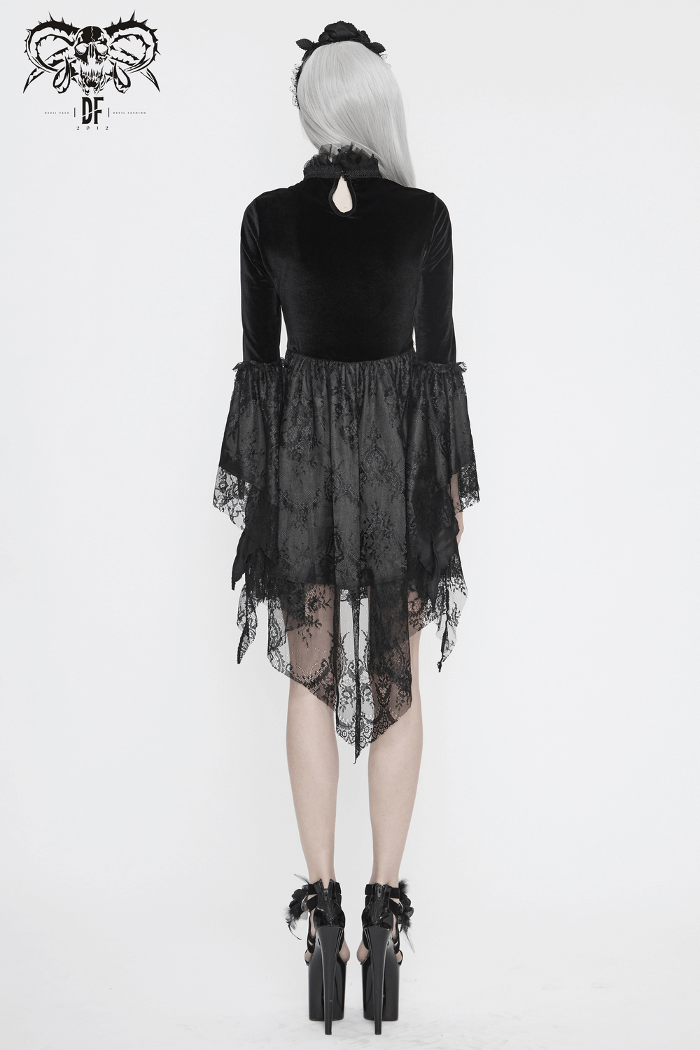 Back view of a Gothic black velvet dress with trumpet sleeves and lace detailing, perfect for an elegant look.