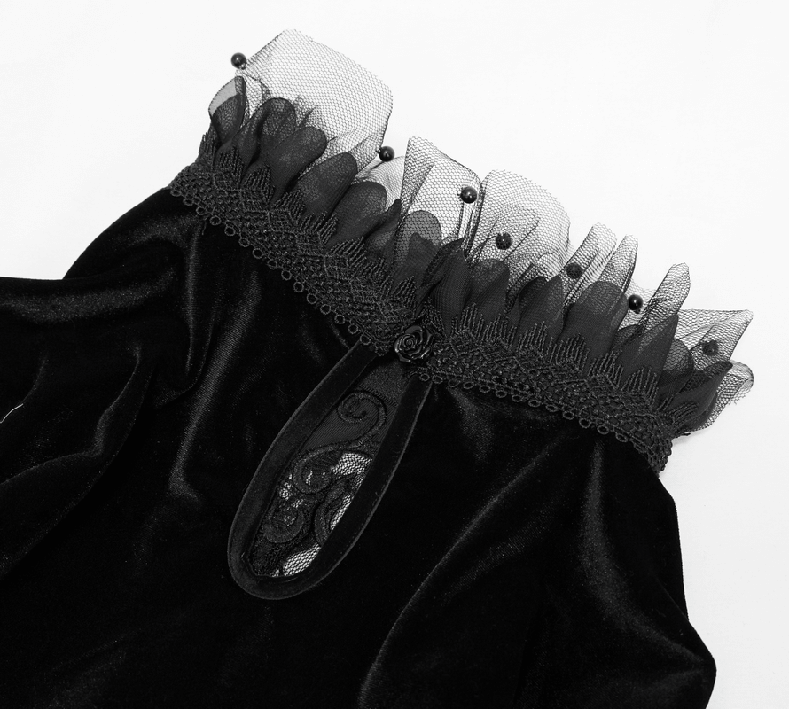 Close-up of the gothic off-shoulder velvet dress showcasing lace and tulle detailing with delicate embellishments.