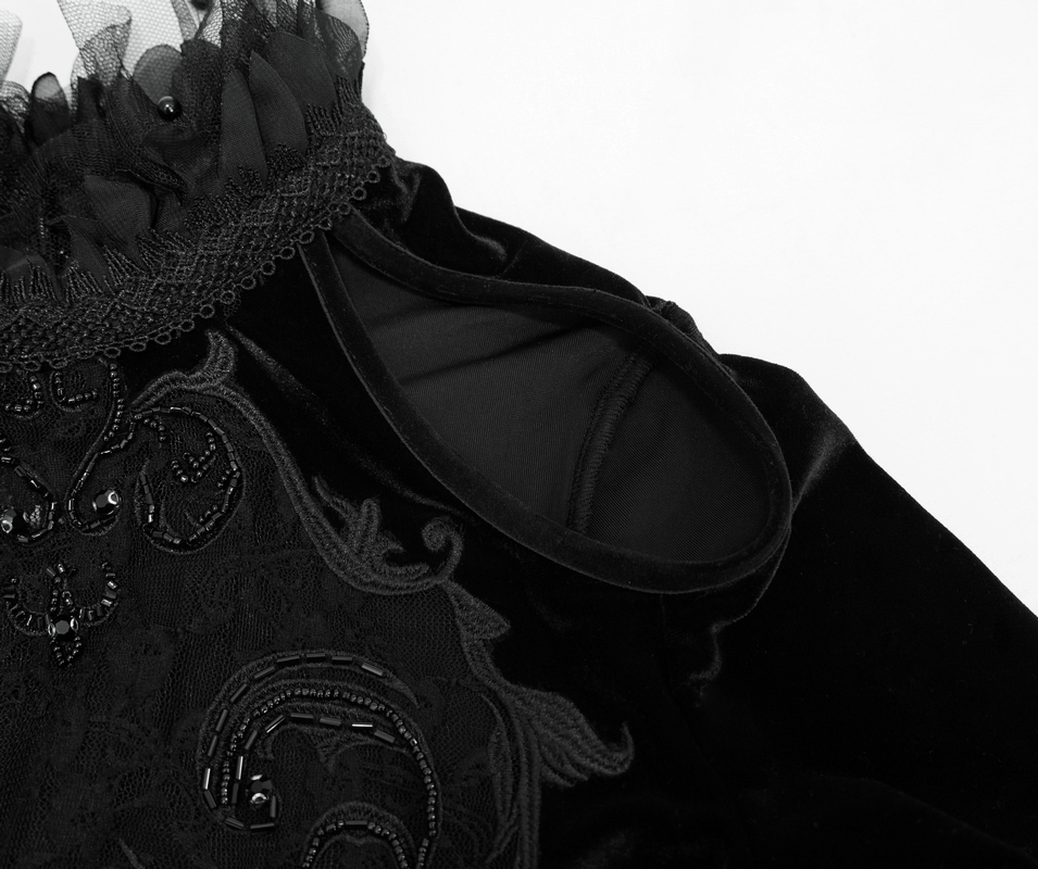 Detail of a Gothic women's off-shoulder velvet dress with intricate lace and ruffle accents.