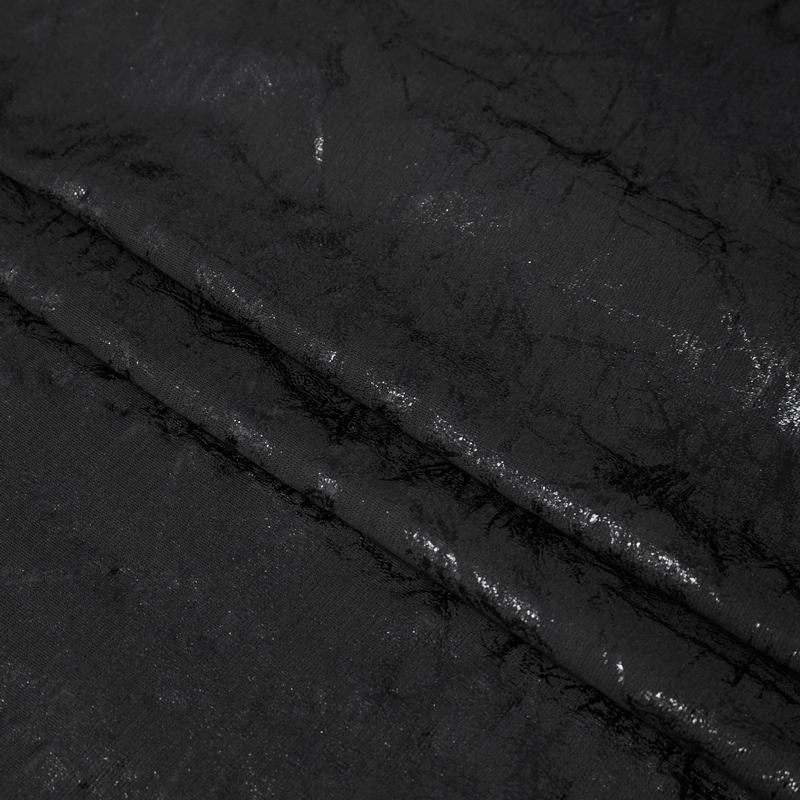 Close-up of black gothic fabric showcasing a stylish pattern for women's fitted pants.